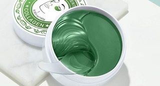 a container with green under eye masks