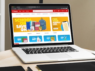 A laptop displaying the Staples website page for school supplies
