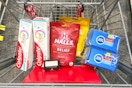 colgate toothpaste, halls cough drops, sponges, and maybelline eyeshadow in a cart