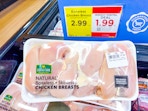 heritage farm chicken in stock at store with price tag