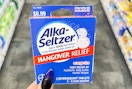 hand holding box of alka-seltzer hangover relief