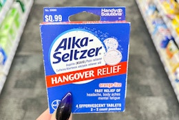 hand holding box of alka-seltzer hangover relief
