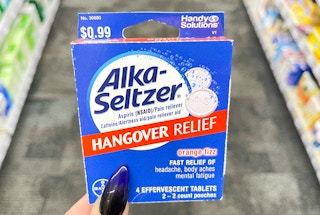 hand holding box of alka-seltzer hangover relief