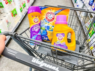 three arm & hammer laundry products in a walgreens shopping cart