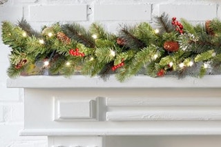 National Tree Company Pre-Lit Artificial Christmas Garland draped on a mantle.