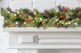 National Tree Company Pre-Lit Artificial Christmas Garland draped on a mantle.