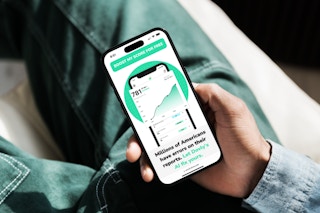 hand holding smartphone with dovly credit score app open