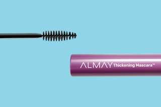 A mascara wand comes from the left, and a tube of Almay Thickening Mascara comes from the right.