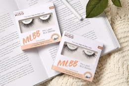 kiss eyelash set on top of book
