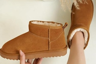 woman holding Project Cloud Ankle Boots
