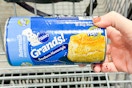 hand holding pillsbury grands biscuits tube