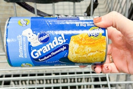 hand holding pillsbury grands biscuits tube
