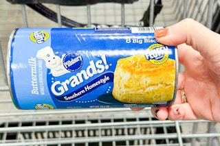 hand holding pillsbury grands biscuits tube