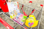 easter basket stuffers in a cart: bluey, fubbles, and peeps