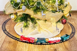 Lifestyle image of the Classic Train Set around a Christmas tree