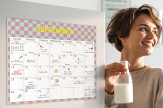 a woman next to a magnetic calendar