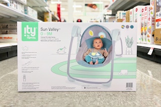 ingenuity baby canopy swing sitting on a floor in a target aisle