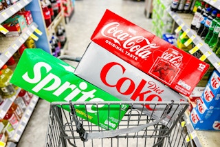 soda 12 packs in a shopping cart