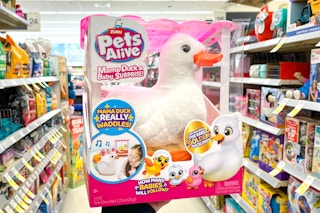 hand holding toy duck