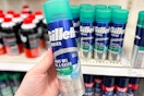 hand holding a gillette shave gel in front of shaving items at target