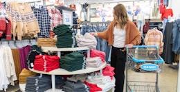 A woman looking at clothing at Old Navy