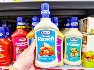hand holding a bottle of kraft salad dressing