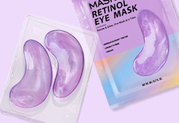 a person with purple eye patches on their face