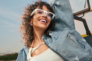 a woman wearing blue light glasses