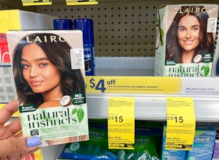 hand holding box of Clairol hair color next to price tag