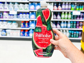 hand holding a bottle of palmolive dish soap in a target aisle