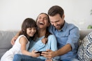 family laughing and playing a would you rather game together