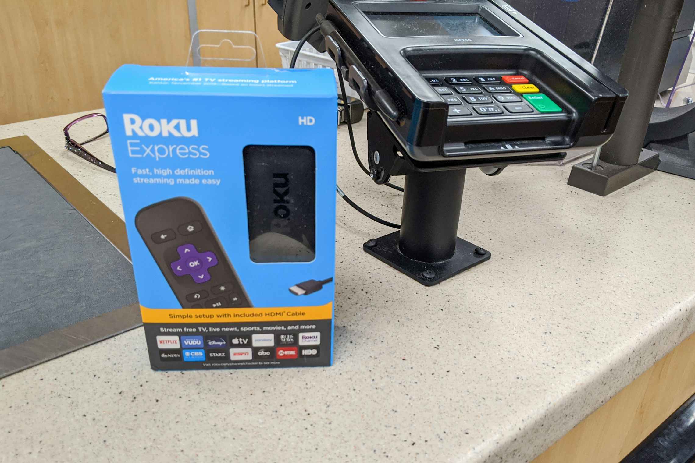 A roku sitting on the return counter at Walmart