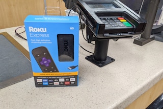 A roku sitting on the return counter at Walmart