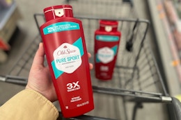 hand holding old spice pure sport body wash with walgreens cart
