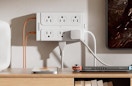 a surge protector on the wall with plugs 