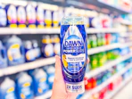 hand holding a bottle of dawn-dish-soap in walmart aisle