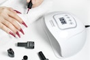 a woman near a nail lamp