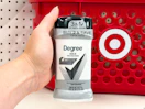 hand holding a twin pack of degree deodorant in front a target basket