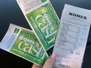 hand holding kohls cash and receipt