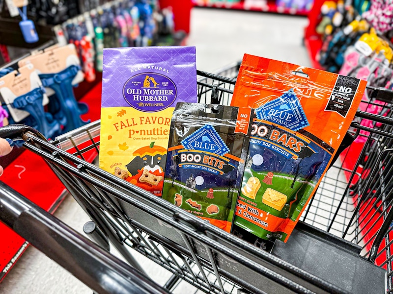 3 bags of halloween dog treats in a cart