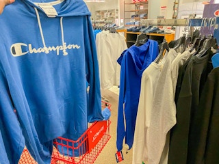 hand holding champion hoodie