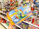 hand holding a hot wheels track set at target