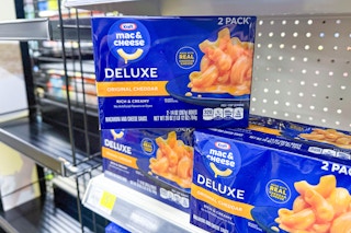 kraft deluxe mac and cheese stacked on store shelf