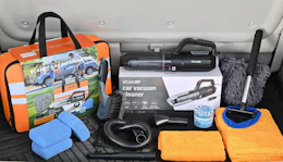 a care cleaning kit in a trunk