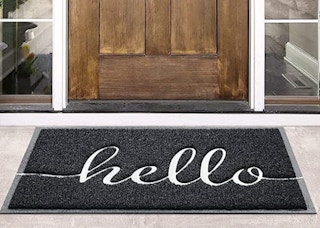 hello gray doormat in front of a door
