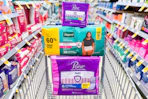 walgreens poise and depend products stacked in a shopping cart