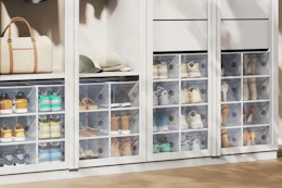 lifestyle image of plastic stackable shoe boxes in a closet