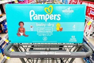 box of Pampers baby-dry diapers in Walgreens shopping cart