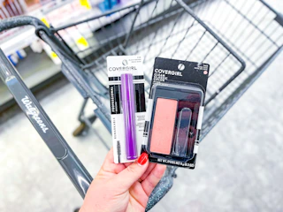 hand holding covergirl blush and mascara in walgreens