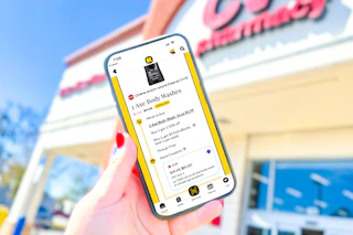 hand holding a smartphone displaying a 1-clip coupon deal in the kcl app